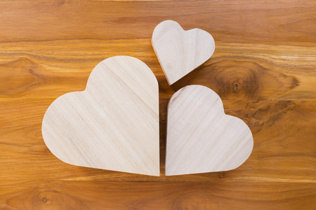 wood heart arrange shaped cloud on brown wooden backgroundの写真素材