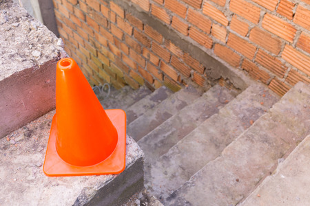 construction cone in construction site with bricksの写真素材