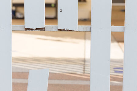 white wood fence of broken damagedの写真素材