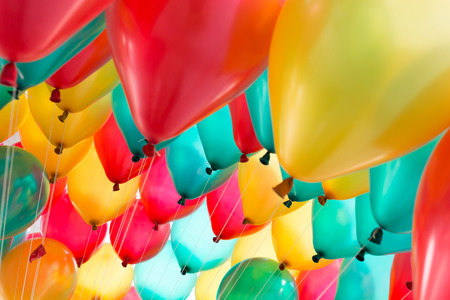 colorful balloons with happy celebration party backgroundの写真素材