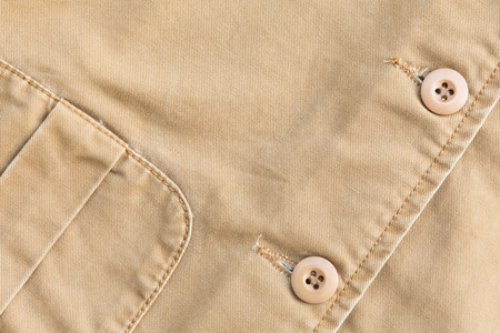 brown shirt background with stitch seam textile and botton