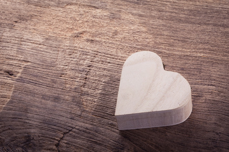 heart brown wood box on wood background, abstract love backgroundの写真素材