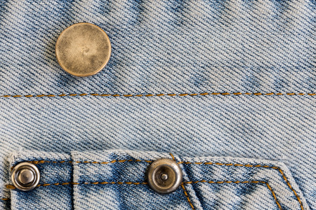 jeans denim clothing with metal button on clothing textile industrialの写真素材