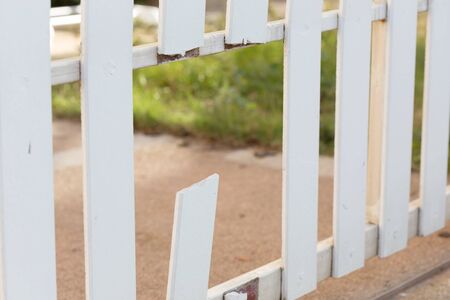 white wood fence of broken damagedの写真素材