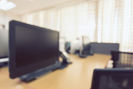 abstract blur background table work in office with computer pcの写真素材