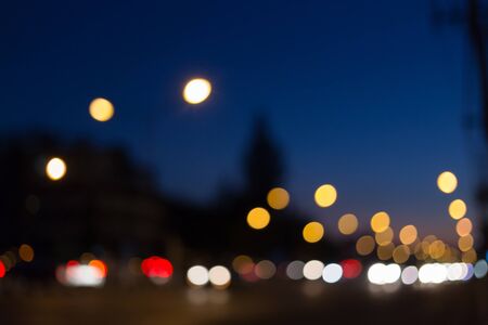 abstract bokeh defocused with car light on streetの写真素材