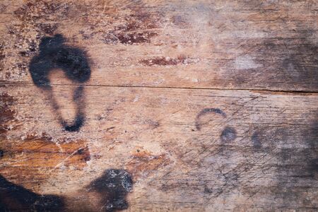 wood board weathered with scratch texture backgroundの写真素材