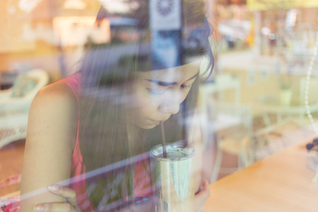 woman drinking a coffee in cafe coffeeの写真素材