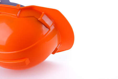 orange safety helmet hard hat, tool protect worker of danger in construction industry, isolated on white backgroundの写真素材