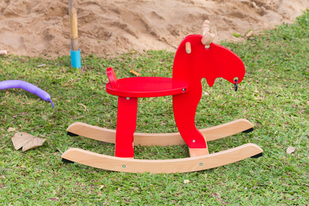 rocking deer chair for kids ride playing in playgroundの写真素材