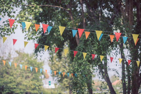 colorful triangular flags of decorated celebrate outdoor partyの写真素材
