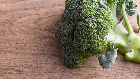 green broccoli organic vegetable on wood board prepared cookingの写真素材