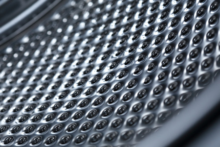 closeup image of washing machine, abstract metallic texture backgroundの写真素材