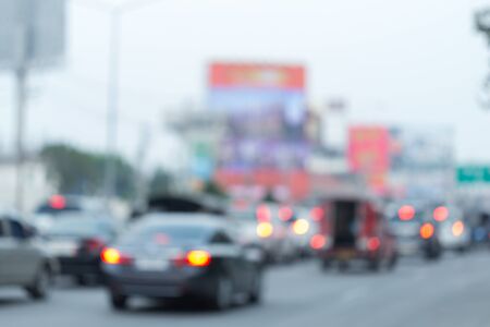 car driving on road with traffic jam in the city, abstract blurred backgroundの写真素材