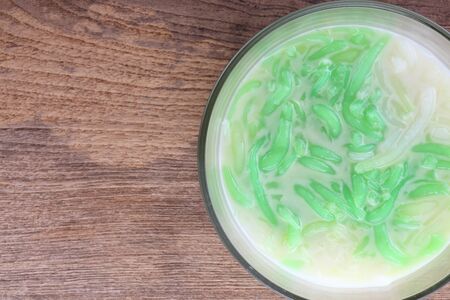 Thai food, Lod Chong dessert coconut milk on wood tableの写真素材