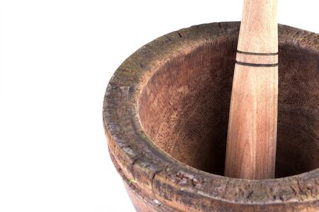 wooden mortar and pestle isolated on white backgroundの写真素材