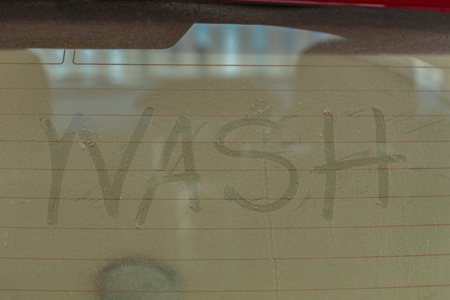 text of car wash on back mirror dirty carの写真素材