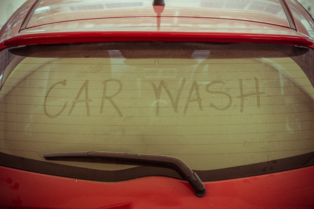 text of car wash on back mirror dirty carの写真素材