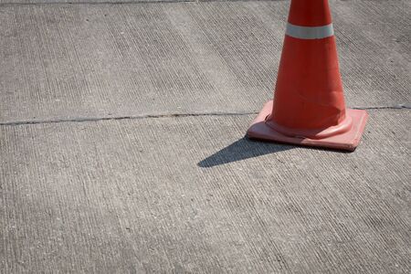 traffic cone on street used warning sign on roadの写真素材