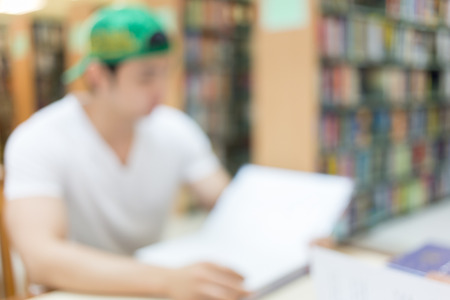 library blur background with student and bookshelfの写真素材