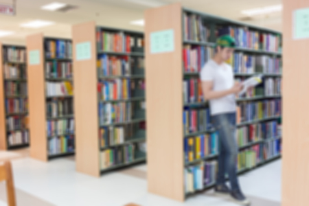 library blur background with student and bookshelfの写真素材