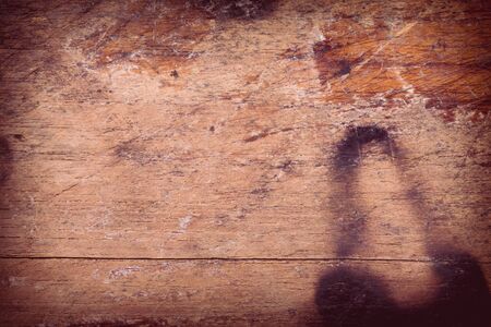 wood board weathered with scratch texture backgroundの写真素材