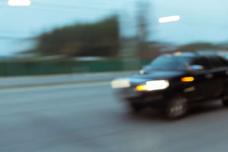 car driving on road with traffic jam in the city, abstract blurred backgroundの写真素材