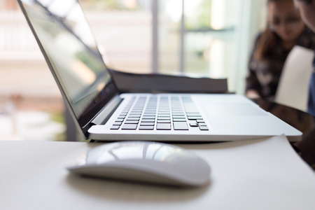 people using laptop working in living room home officeの写真素材