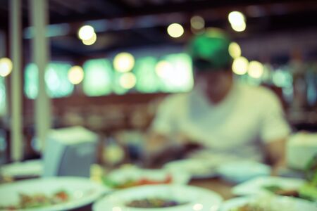people dinner in restaurant abstract blurred backgroundの写真素材