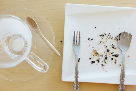 leftover of milk with glass on wood tableの写真素材