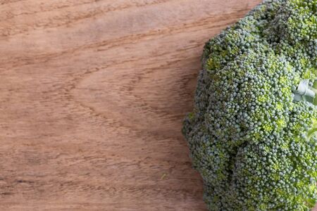 green broccoli organic vegetable on wood board prepared cookingの写真素材