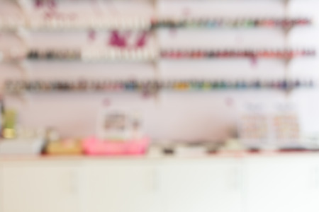 shelf of bottle nail polish in beauty salon, image abstract blur defocused backgroundの写真素材