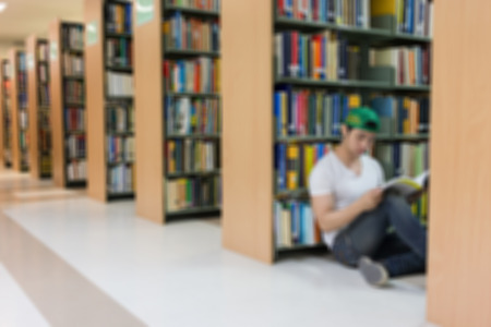 library blur background with student and bookshelfの写真素材