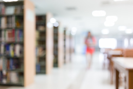 library blur background with student and bookshelfの写真素材
