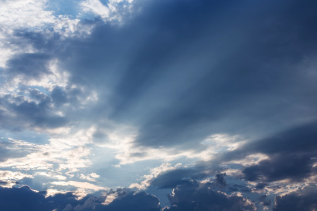 light of sunbeam on blue sky background with clouds and sun light