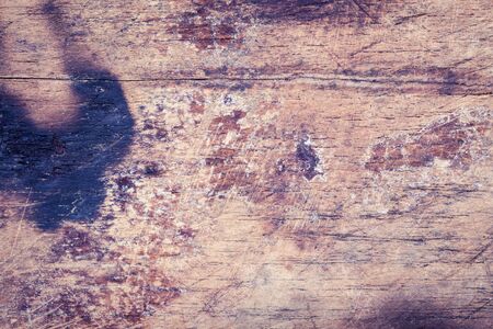 wood board weathered with scratch texture backgroundの写真素材