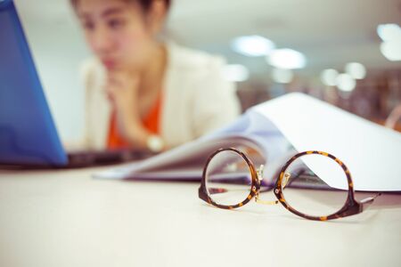 close-up eyeglasses, study education, working womanの写真素材
