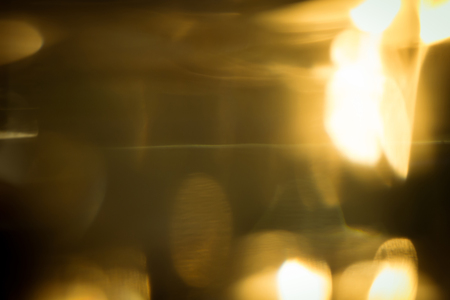 abstract gold light glitter glowing for celebration festive backgroundの写真素材