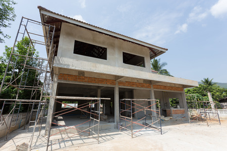 building residential construction house with scaffold steel for construction workerの写真素材