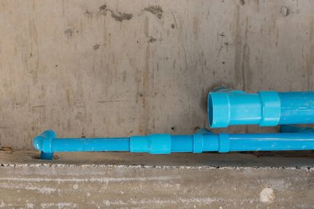 water pipes pvc plumbing under cement ceiling of second floor in construction site buildingの写真素材