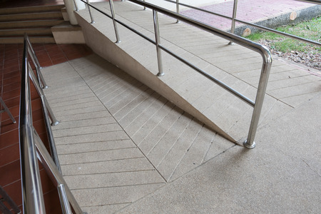 ramp way for support wheelchair disabled people made from sand and small gravel stone washed floorの写真素材