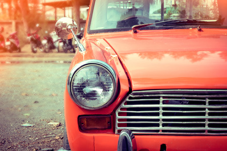 close-up headlight of colourful classic car, image used filter vintageの写真素材
