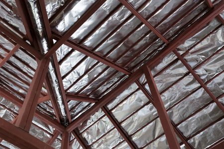 roof with steel beam and silver foil insulation heat on ceiling roof houseの写真素材