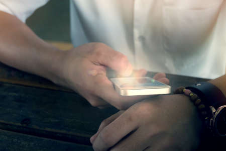 businessman using a mobile phone with texting message on app smartphone, playing internet on mobile