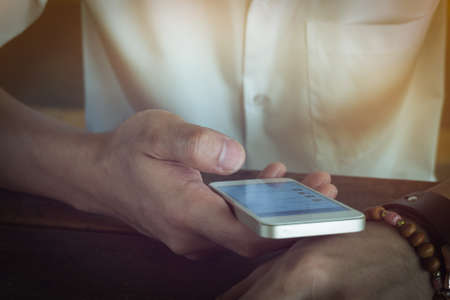 businessman using a mobile phone with texting message on app smartphone, playing internet on mobile