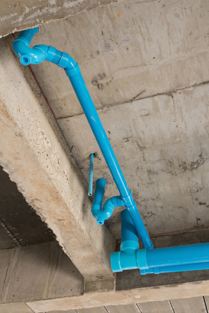 water pipes pvc plumbing under cement ceiling of second floor in construction site building