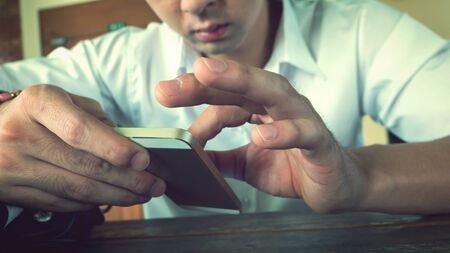 businessman using a mobile phone with texting message on app smartphone, playing internet on mobile