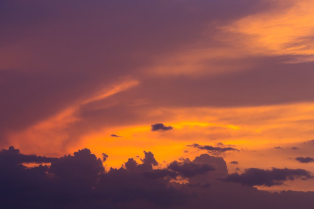 colorful dramatic sunset sky with orange cloud, twilight sky backgroundの写真素材