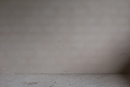 plaster mortar wall and cement floor in construction siteの写真素材