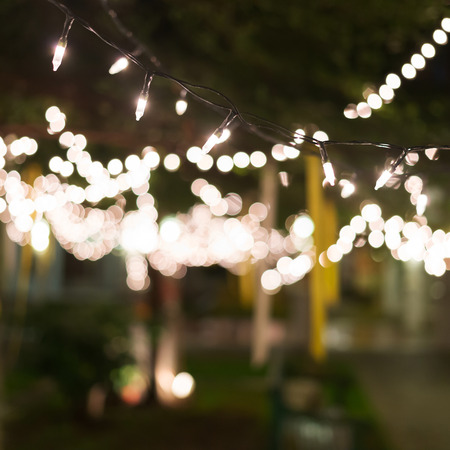 decoration light christmas celebration hanging on tree, abstract image blurred defocused backgroundの写真素材
